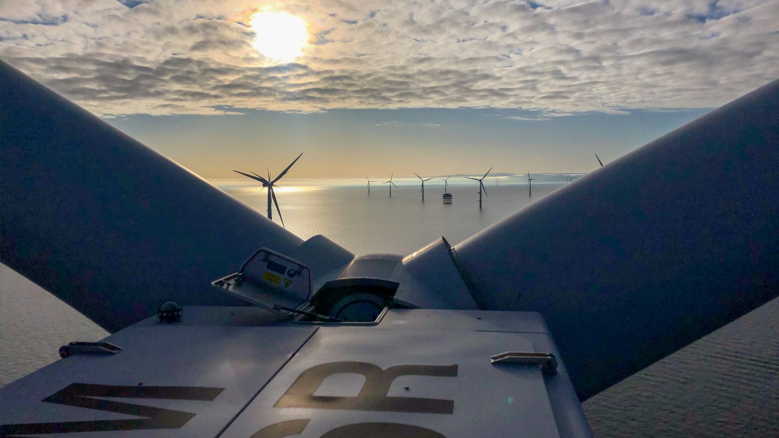 Image looking out from the top of an offshore wind turbine looking at the sunset